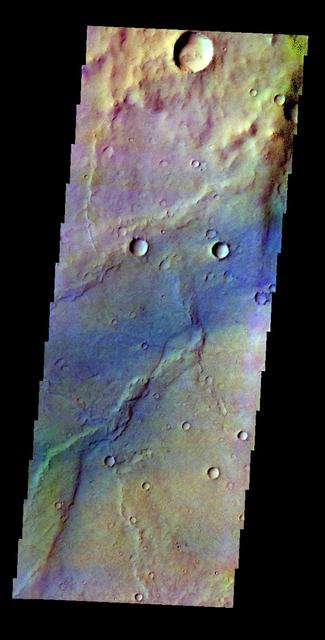 The THEMIS VIS camera contains 5 filters. The data from different filters can be combined in multiple ways to create a false color image. This false color image from NASA 2001 Mars Odyssey spacecraft shows a region in Syrtis Major.