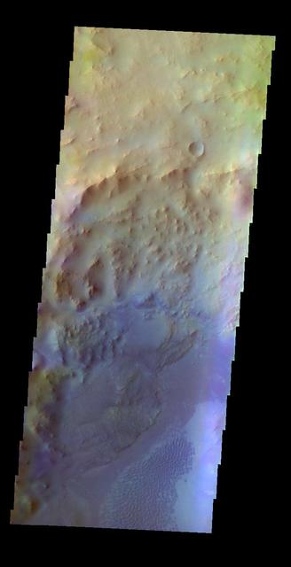 The THEMIS VIS camera contains 5 filters. The data from different filters can be combined in multiple ways to create a false color image. This false color image from NASA 2001 Mars Odyssey spacecraft shows part of Hargraves Crater.