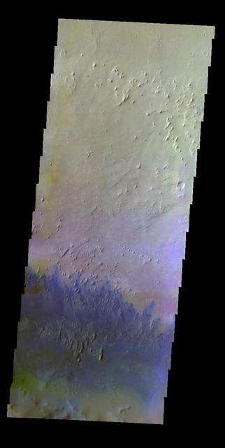 The THEMIS VIS camera contains 5 filters. The data from different filters can create a false color image. This false color image from NASA 2001 Mars Odyssey spacecraft shows small dunes of the floor of Capen Crater in Terra Sabea.