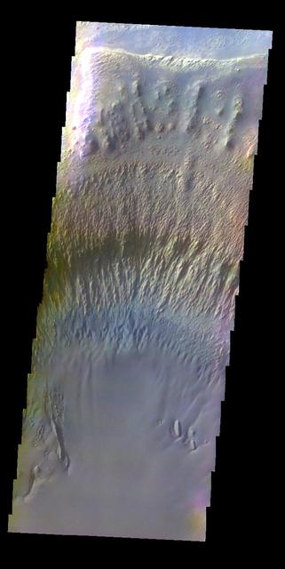 The THEMIS VIS camera contains 5 filters. The data from different filters can be combined in multiple ways to create a false color image. This false color image from NASA 2001 Mars Odyssey spacecraft shows part of the interior of Ganges Chasma.