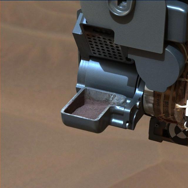 This image from NASA Curiosity rover shows a sample of powdered rock extracted by the rover drill from the Confidence Hills target -- the first rock drilled after Curiosity reached the base of Mount Sharp in September 2014.