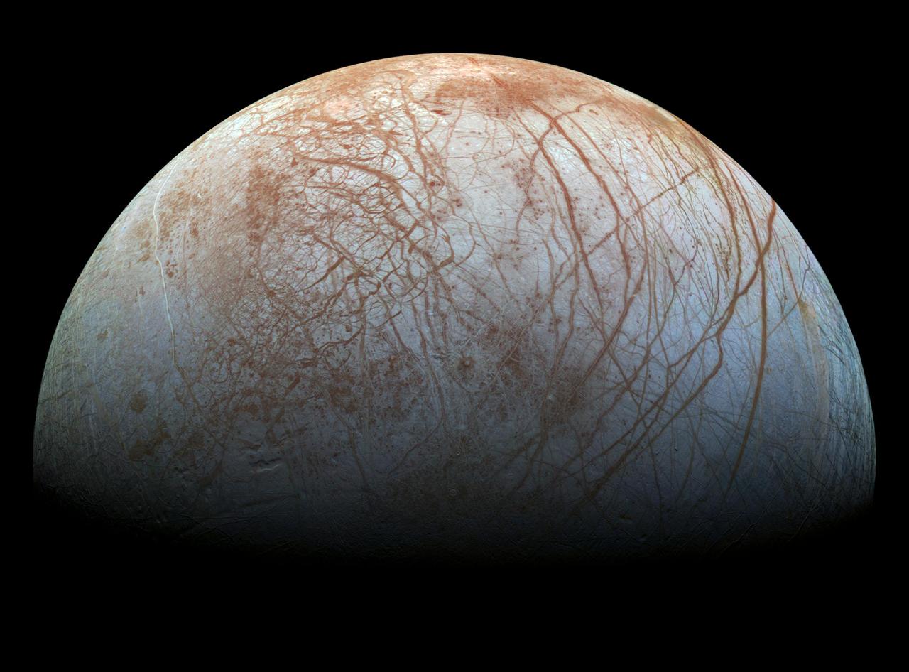The puzzling, fascinating surface of Jupiter icy moon Europa looms large in this newly-reprocessed [sic] color view, made from images taken by NASA Galileo spacecraft in the late 1990s. This is the color view of Europa from Galileo that shows the largest portion of the moon's surface at the highest resolution.  The view was previously released as a mosaic with lower resolution and strongly enhanced color (see PIA02590). To create this new version, the images were assembled into a realistic color view of the surface that approximates how Europa would appear to the human eye.  The scene shows the stunning diversity of Europa's surface geology. Long, linear cracks and ridges crisscross the surface, interrupted by regions of disrupted terrain where the surface ice crust has been broken up and re-frozen into new patterns.  Color variations across the surface are associated with differences in geologic feature type and location. For example, areas that appear blue or white contain relatively pure water ice, while reddish and brownish areas include non-ice components in higher concentrations. The polar regions, visible at the left and right of this view, are noticeably bluer than the more equatorial latitudes, which look more white. This color variation is thought to be due to differences in ice grain size in the two locations.  Images taken through near-infrared, green and violet filters have been combined to produce this view. The images have been corrected for light scattered outside of the image, to provide a color correction that is calibrated by wavelength. Gaps in the images have been filled with simulated color based on the color of nearby surface areas with similar terrain types.  This global color view consists of images acquired by the Galileo Solid-State Imaging (SSI) experiment on the spacecraft's first and fourteenth orbits through the Jupiter system, in 1995 and 1998, respectively. Image scale is 1 mile (1.6 kilometers) per pixel. North on Europa is at right.  http://photojournal.jpl.nasa.gov/catalog/PIA19048