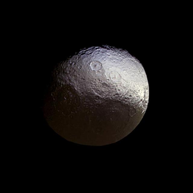 NASA Cassini spacecraft stared toward Saturn two-toned moon Iapetus for about a week in early 2015, in a campaign motivated in part to investigate subtle color differences within the moon bright terrain.