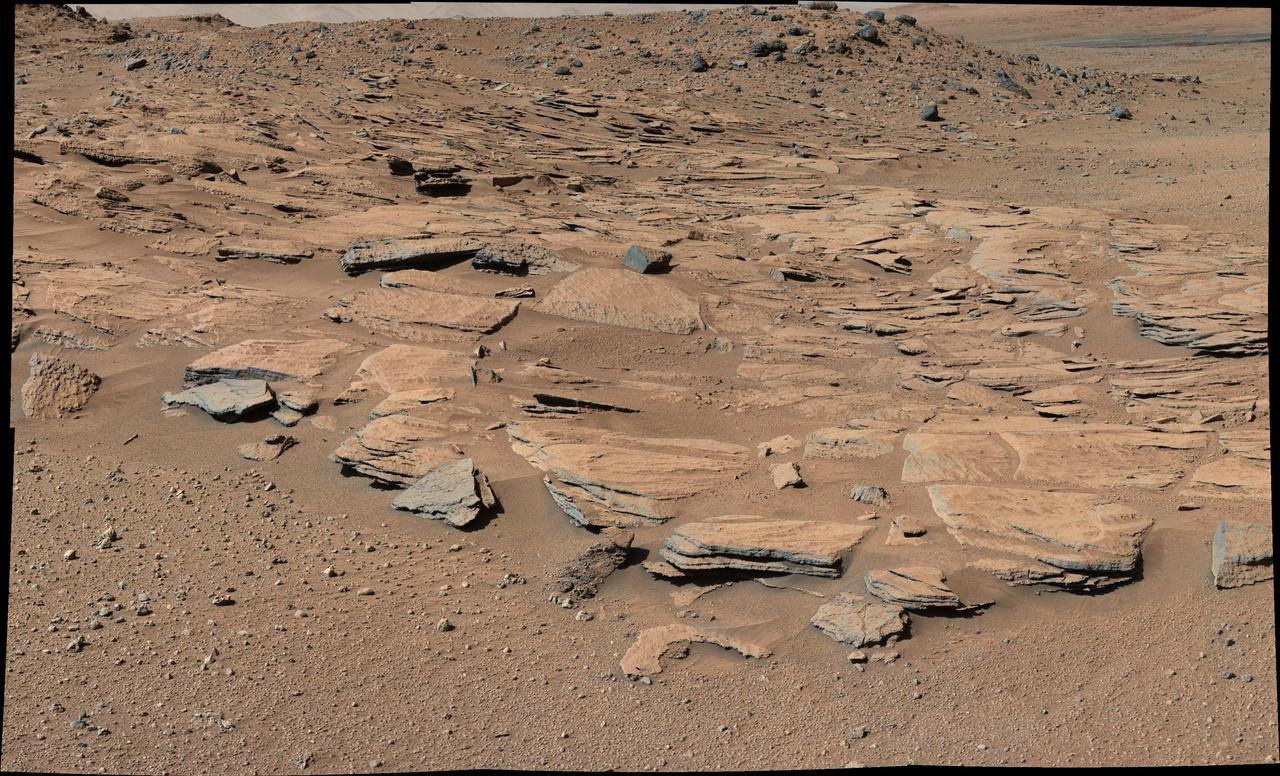 This image from Curiosity Mastcam shows inclined beds of sandstone interpreted as the deposits of small deltas fed by rivers flowing down from the Gale Crater rim and building out into a lake where Mount Sharp is now.