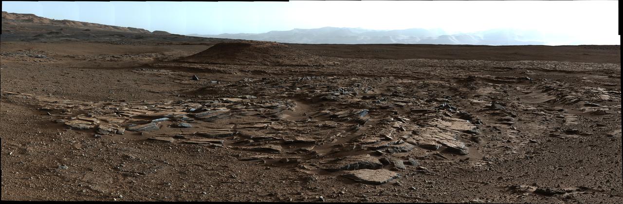 This image from Curiosity Mastcam looks to the west of a waypoint on the rover route to Mount Sharp. The mountain lies to the left of the scene.