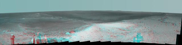 NASA Mars Exploration Rover Opportunity gained this stereo vista from the top of a raised segment of the rim of Endeavour Crater. The view appears three-dimensional when seen through 3D glasses with red lens on the left.