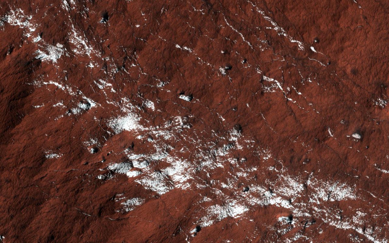 Polar layered deposits slopes are quite extensive and partially surround the South polar residual cap as seen in this image from NASA Mars Reconnaissance Orbiter.