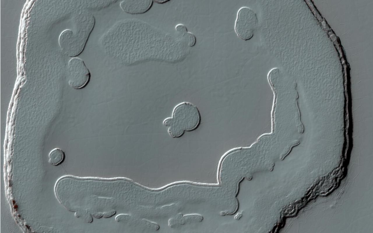 This image from NASA Mars Reconnaissance Orbiter is of an approximately 5 kilometer approx. 3.1 mile diameter crater that is one of the rare examples of a fresh lunar-like crater on Mars.
