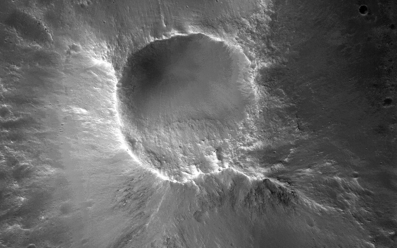 There are many knob formations is the southeastern Acidalia region of Mars. All show a hilltop crest except one which has a summit crater that resembles a cone volcano in this image captured by NASA Mars Reconnaissance Orbiter.