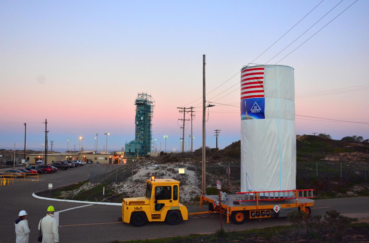 NASA Soil Moisture Active Passive SMAP satellite is transported across Vandenberg Air Force Base in California to Space Launch Complex 2, where it will be mated to a Delta II rocket for launch, targeted for Jan. 29.