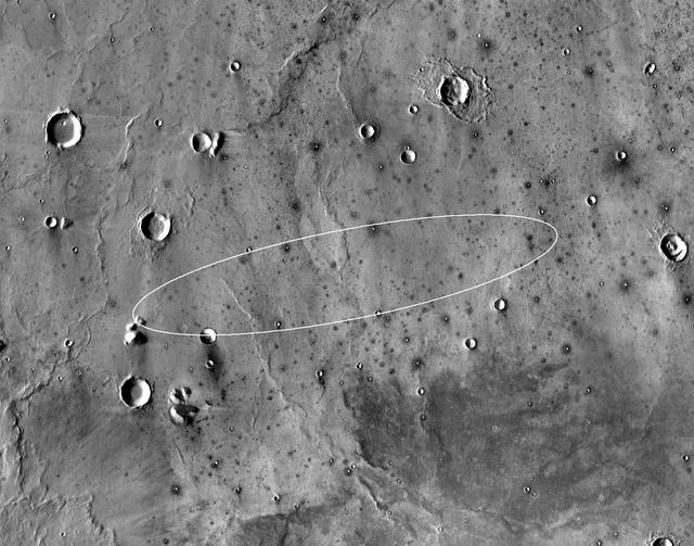 This map shows the single area under continuing evaluation as the InSight mission's Mars landing site, as of a year before the mission's May 2016 launch. The finalist ellipse marked within the northern portion of flat-lying Elysium Planitia is centered at about 4.5 degrees north latitude and 136 degrees east longitude.  InSight -- an acronym for Interior Exploration using Seismic Investigations, Geodesy and Heat Transport -- will study the interior of Mars to improve understanding of the processes that formed and shaped rocky planets, including Earth. The mission's launch period begins March 4, 2016, and lasts until late March. Whichever day during that period the launch occurs, landing is scheduled for Sept. 28, 2016.  The landing ellipse on this map covers an area within which the spacecraft has about 99 percent chance of landing when targeted for the center of the ellipse. It is about 81 miles (130 kilometers) long, generally west to east, and about 17 miles (27 kilometers) wide. This ellipse covers the case of a launch at the start of the launch period. If the launch occurs later in the period, orientation of the landing ellipse would shift slightly clockwise.  Four semifinalist sites in Elysium Planitia were evaluated as safe for InSight landing. This one was selected as having the largest proportion of its area classified as smooth terrain. If continuing analysis identifies unexpected problems with this site, another of the semifinalists could be reconsidered before final selection later this year.  The InSight lander will deploy two instruments directly onto the ground using a robotic arm. One is a seismometer contributed by France's space agency (CNES) with components from Germany, Switzerland, the United Kingdom and the United States. The seismometer will measure microscopic ground motions, providing detailed information about the interior structure of Mars. The other instrument to be deployed by the arm is a heat-flow probe contributed by the German Aerospace Center (DLR), designed to hammer itself three to five meters (about 10 to 16 feet) deep. It will monitor heat coming from the planet's interior. The mission will also track the lander's radio to measure wobbles in the planet's rotation that relate to the size of its core. A suite of environmental sensors will monitor the weather and variations in the magnetic field.  The base map is a mosaic of daytime thermal images from the Thermal Emission Imaging System (THEMIS) on NASA's Mars Odyssey orbiter. THEMIS was developed and is operated by Arizona State University, Tempe.  Note: After thorough examination, NASA managers have decided to suspend the planned March 2016 launch of the Interior Exploration using Seismic Investigations Geodesy and Heat Transport (InSight) mission. The decision follows unsuccessful attempts to repair a leak in a section of the prime instrument in the science payload.  http://photojournal.jpl.nasa.gov/catalog/PIA19143