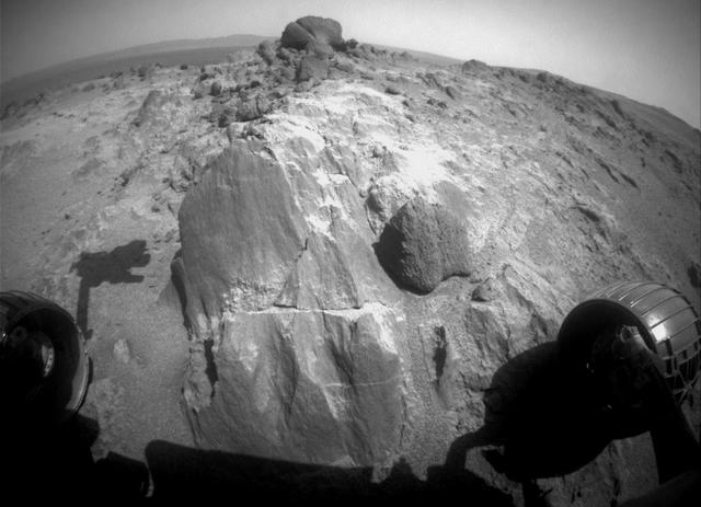 The flat-faced rock near the center of this image is a target for contact investigation by NASA's Mars Exploration Rover Opportunity in early March 2015.  The view is from the rover's front hazard avoidance camera on March 3, 2015, during the 3,948th Martian day, or sol, of Opportunity's work on Mars. This camera is mounted low on the rover and has a wide-angle lens. The scene includes a shadow of the tool turret at the end of Opportunity's robotic arm.  The rock includes a target called "Sergeant Charles Floyd," for the quartermaster of the Lewis and Clark expedition.  http://photojournal.jpl.nasa.gov/catalog/PIA19146