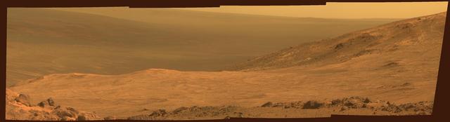 This view from NASA's Mars Exploration Rover Opportunity shows part of "Marathon Valley," a destination on the western rim of Endeavour Crater, as seen from an overlook north of the valley. The scene spans from east, at left, to southeast. It combines four pointings of the rover's panoramic camera (Pancam) on March 13, 2015, during the 3,958th Martian day, or sol, of Opportunity's work on Mars. The rover team selected Marathon Valley as a science destination because observations of this location using the Compact Reconnaissance Imaging Spectrometer for Mars (CRISM) instrument on NASA's Mars Reconnaissance Orbiter yielded evidence of clay minerals, a clue to ancient wet environments. By the time Opportunity explores Marathon Valley, the rover will have exceeded a total driving distance equivalent to an Olympic marathon. Opportunity has been exploring the Meridiani Planum region of Mars since January 2004. This version of the image is presented in approximate true color by combining exposures taken through three of the Pancam's color filters at each of the four camera pointings, using filters centered on wavelengths of 753 nanometers (near-infrared), 535 nanometers (green) and 432 nanometers (violet). http://photojournal.jpl.nasa.gov/catalog/PIA19151