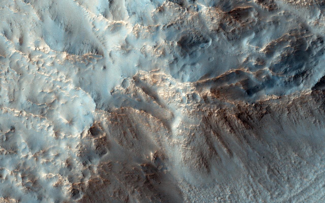 NASA Mars Reconnaissance Orbiter observes the southeast rim of Hale Crater, about 150 kilometers 90 miles in diameter and located in the mid-southern latitudes just north of the massive Argyre basin.  RSL are often found on northwest-facing slopes, and they occur in the central peak of Hale. During the season when we know RSL appear, this observation at high resolution might help us see if they occur elsewhere.  http://photojournal.jpl.nasa.gov/catalog/PIA19176