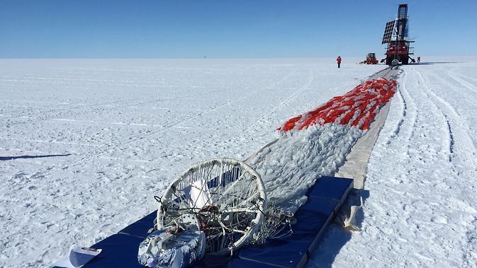 Prior to launch, the team laid out the parachute and hang lines in front of SPIDER, seen in the distance. The long-duration balloon that would carry SPIDER into the sky is attached to the end of the parachute shown here in the foreground.  http://photojournal.jpl.nasa.gov/catalog/PIA19177