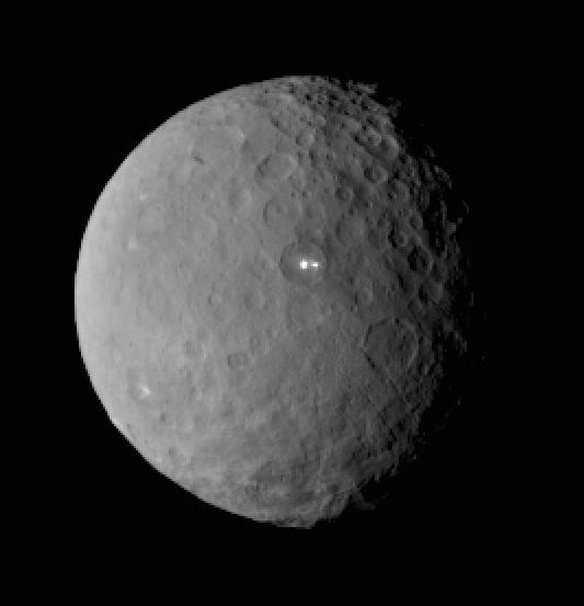 This image was taken by NASA Dawn spacecraft of dwarf planet Ceres on Feb. 19 from a distance of nearly 29,000 miles 46,000 kilometers. It shows that the brightest spot on Ceres has a dimmer companion, which apparently lies in the same basin.  http://photojournal.jpl.nasa.gov/catalog/PIA19185