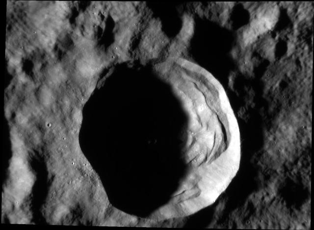 On Mercury, craters larger than approximately 10-12 km display a complex morphology, with slump terraces and central peaks, as compared to smaller bowl-shaped craters. At this complex crater, nearly 20 km in diameter, boulders created by the impact event can be seen outside the southwest rim and within the crater interior. The largest boulder observed here is around 180 m (590 feet) across! For comparison with humans for scale, check out the lunar House Rock at the Apollo 16 site, which is (only) 24 meters across.  Date acquired: January 24, 2015 Image Mission Elapsed Time (MET): 64441328 Image ID: 7855678 Instrument: Narrow Angle Camera (NAC) of the Mercury Dual Imaging System (MDIS) Center Latitude: -2.66° Center Longitude: 83.54° E Resolution: 26 meters/pixel Scale: This crater is approximately 19.5 km (12.1 miles) in diameter Incidence Angle: 82.8° Emission Angle: 43.0° Phase Angle: 39.8°  http://photojournal.jpl.nasa.gov/catalog/PIA19202