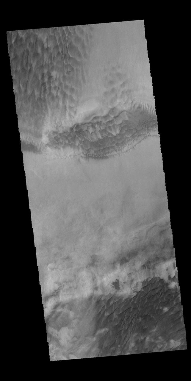 This image captured by NASA 2001 Mars Odyssey spacecraft shows multiple dune fields cover the floor of Hooke Crater, located on the northern margin of Argyre Planitia. Orbit Number: 58008 Latitude: -44.8922 Longitude: 315.418 Instrument: VIS Captured: 2015-01-11 02:40 http://photojournal.jpl.nasa.gov/catalog/PIA19205