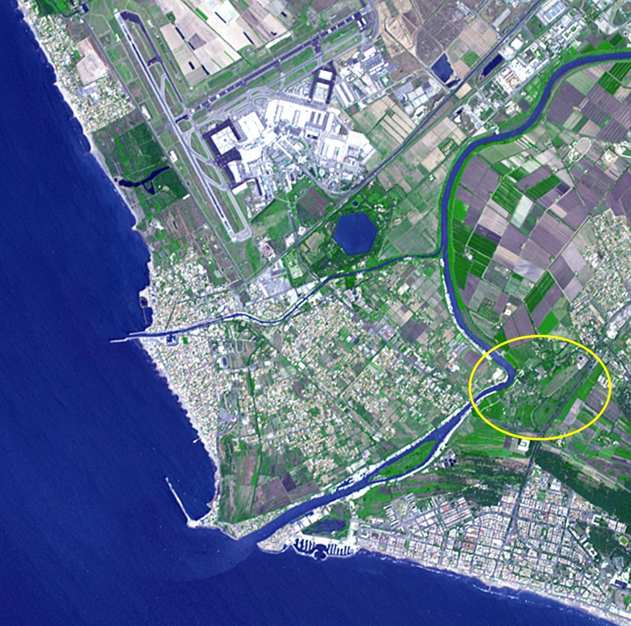 Thirty kilometers southwest of Rome lies what may be ancient Rome's greatest engineering achievement: Portus. Built in the first century A.D., Portus was Rome's principal maritime harbor, replacing the port city of Ostia on the Tiber River (circled area) that had become inadequate to handle the hundreds of ships loaded with food stuffs to feed Rome's 1 million+ inhabitants. The hexagonal Trajanic Basin and the outer Claudian Basin (now silted up) formed a port complex without equal. In 2000 years, the coastline has moved seaward, and the Trajanic Basin is now a private lake. The image was acquired June 29, 2014, covers an area of 10 by 10 km, and is located at 41.7 degrees north, 12.3 degrees east.   http://photojournal.jpl.nasa.gov/catalog/PIA19209