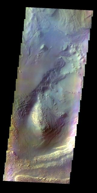 The THEMIS VIS camera contains 5 filters. The data from different filters can be combined in multiple ways to create a false color image. This false color image from NASA 2001 Mars Odyssey spacecraft shows part of Ganges Chasma.  Orbit Number: 4434 Latitude: -6.76774 Longitude: 310.838 Instrument: VIS Captured: 2002-12-14 13:03  http://photojournal.jpl.nasa.gov/catalog/PIA19214