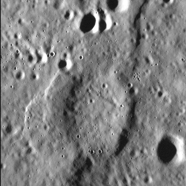 It is no secret that Mercury's surface is scarred by abundant tectonic deformation, the vast majority of which is due to the planet's history of cooling and contraction through time. Yet Mercury is also heavily cratered, and hosts widespread volcanic plains. So it's perhaps unsurprising that these three types of landform often intersect-literally-as shown in this scene. Here, an unnamed crater, about 7.5 km (4.7 mi.) in diameter was covered, and almost fully buried, by lava. At some point after, compression of the surface formed scarps and ridges in the area that, when they reached the buried crater, came to describe its curved outline. Many arcuate ridges on Mercury formed this way. In this high-resolution view, we can also see the younger, later population of smaller craters that pock-mark the surface.  http://photojournal.jpl.nasa.gov/catalog/PIA19263