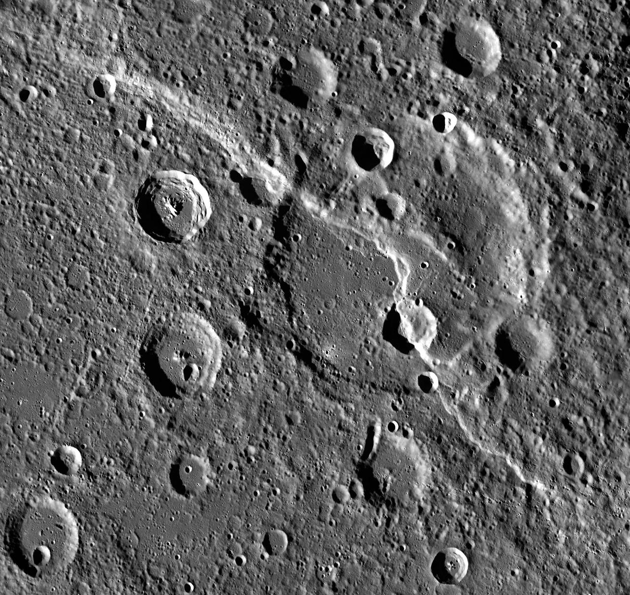 Carnegie Rupes makes a dramatic sight in this large image mosaic. The giant lobate scarp cuts through Duccio crater. If you were to approach the scarp from the southwest, you would find yourself facing a wall nearly 2 km high! Be sure to zoom in for a closer look!  Carnegie Rupes was named after a research vessel launched in 1909. The ship was built almost entirely from wood and other non-magnetic materials to allow sensitive magnetic measurements to be taken for the Carnegie Institution's Department of Terrestrial Magnetism.  http://photojournal.jpl.nasa.gov/catalog/PIA19279