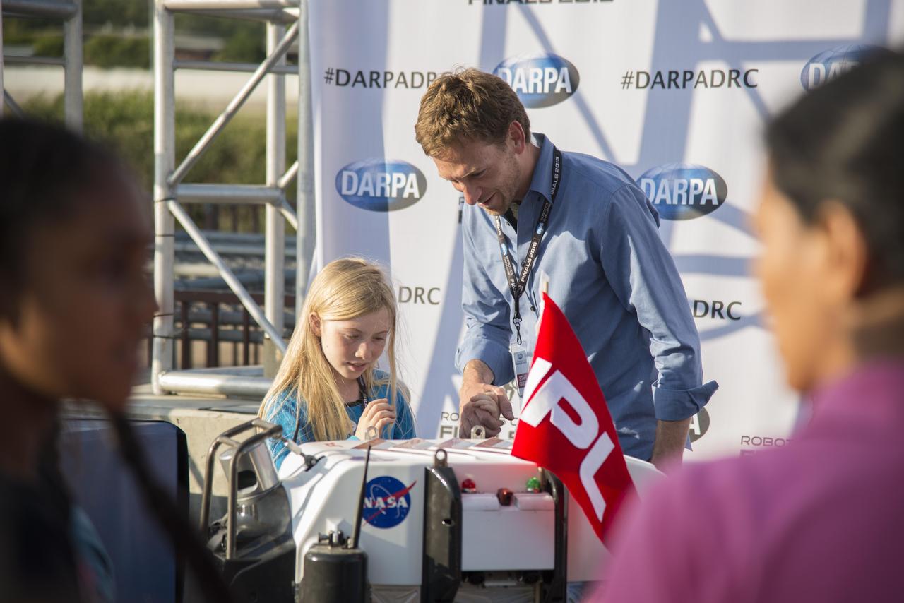This image was taken on June 6, 2015 at the DARPA Robotics Challenge in Pomona, California. Following each competition run, spectators at the event were able to get a close-up look at the robot competitors and meet the teams who built them.   http://photojournal.jpl.nasa.gov/catalog/PIA19327