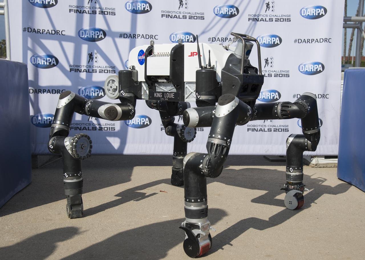The spindly appearance of JPL's RoboSimian was somewhat unique among competitors in the DARPA Robotics Challenge Finals in Pomona, California, as most were bipedal walkers. This image was taken on June 5, 2015.   http://photojournal.jpl.nasa.gov/catalog/PIA19328