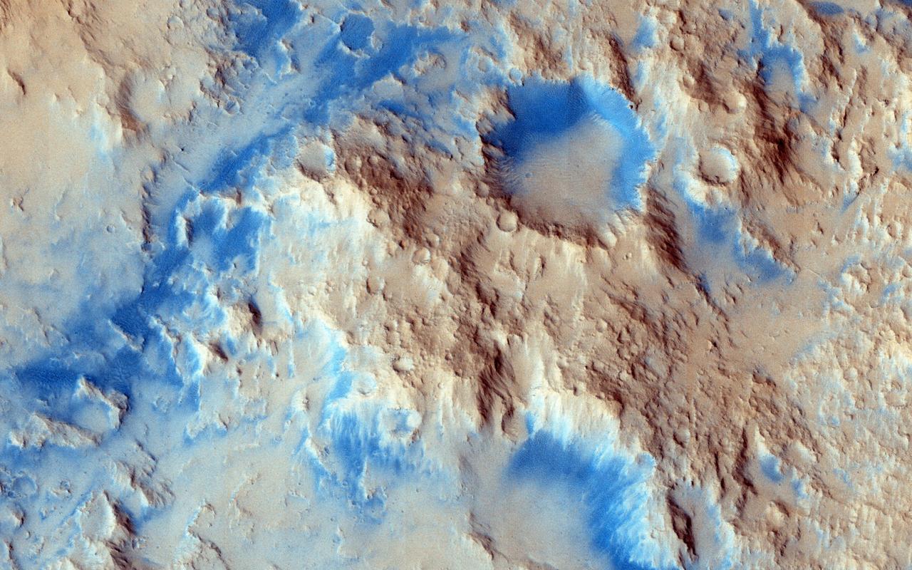 There are some interesting erosional signs in this observation from NASA Mars Reconnaissance Orbiter, which will make for a good comparison with other intracrater fans and fluvial sedimentary landforms.  We can also see an inverted channel system, possibly ponded toward the southwest. As we've learned recently, it's possible that perhaps a fluid was in part of this crater, as is hypothesized for Gale Crater (see artist rendition picture) where Curiosity is exploring. At high resolution, we might be able to resolve fine-scale layering/bedding and/or large, transported clasts (boulders).  Reuyl Crater is approximately 86 kilometers in diameter and was named after Dirk Reuyl, a Dutch-American physicist and astronomer (1906-1972) who made astronomical measurements of the diameter of Mars in the 1940s.  http://photojournal.jpl.nasa.gov/catalog/PIA19356