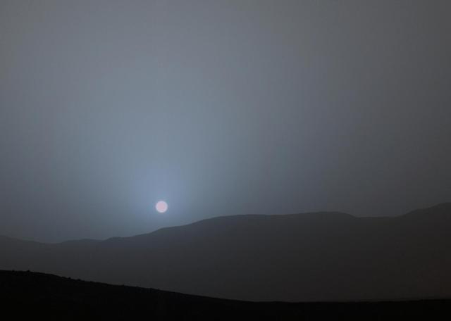 NASA's Curiosity Mars rover recorded this sequence of views of the sun setting at the close of the mission's 956th Martian day, or sol (April 15, 2015), from the rover's location in Gale Crater.  The four images shown in sequence here were taken over a span of 6 minutes, 51 seconds.  This was the first sunset observed in color by Curiosity. The images come from the left-eye camera of the rover's Mast Camera (Mastcam). The color has been calibrated and white-balanced to remove camera artifacts. Mastcam sees color very similarly to what human eyes see, although it is actually a little less sensitive to blue than people are.  Dust in the Martian atmosphere has fine particles that permit blue light to penetrate the atmosphere more efficiently than longer-wavelength colors. That causes the blue colors in the mixed light coming from the sun to stay closer to sun's part of the sky, compared to the wider scattering of yellow and red colors. The effect is most pronounced near sunset, when light from the sun passes through a longer path in the atmosphere than it does at mid-day.  Malin Space Science Systems, San Diego, built and operates the rover's Mastcam. NASA's Jet Propulsion Laboratory, a division of the California Institute of Technology, Pasadena, manages the Mars Science Laboratory Project for NASA's Science Mission Directorate, Washington. JPL designed and built the project's Curiosity rover.  http://photojournal.jpl.nasa.gov/catalog/PIA19401