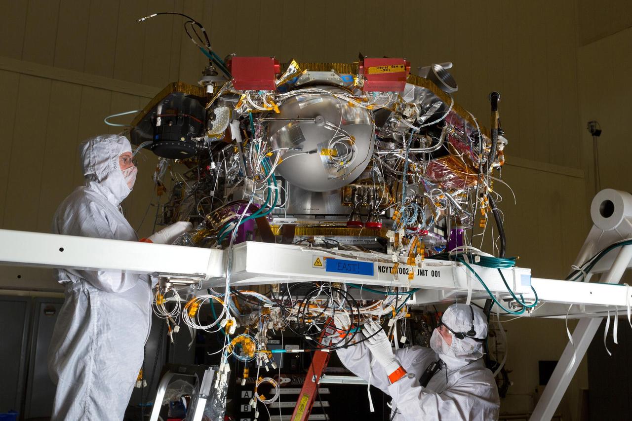 The Mars lander that NASA's InSight mission will use for investigating how rocky planets formed and evolved is being assembled by Lockheed Martin Space Systems, Denver. In this scene from January 2015, Lockheed Martin spacecraft specialists are working on the lander in a clean room. InSight, for Interior Exploration Using Seismic Investigations, Geodesy and Heat Transport, is scheduled for launch in March 2016 and landing in September 2016. Note: After thorough examination, NASA managers have decided to suspend the planned March 2016 launch of the Interior Exploration using Seismic Investigations Geodesy and Heat Transport (InSight) mission. The decision follows unsuccessful attempts to repair a leak in a section of the prime instrument in the science payload. http://photojournal.jpl.nasa.gov/catalog/PIA19402