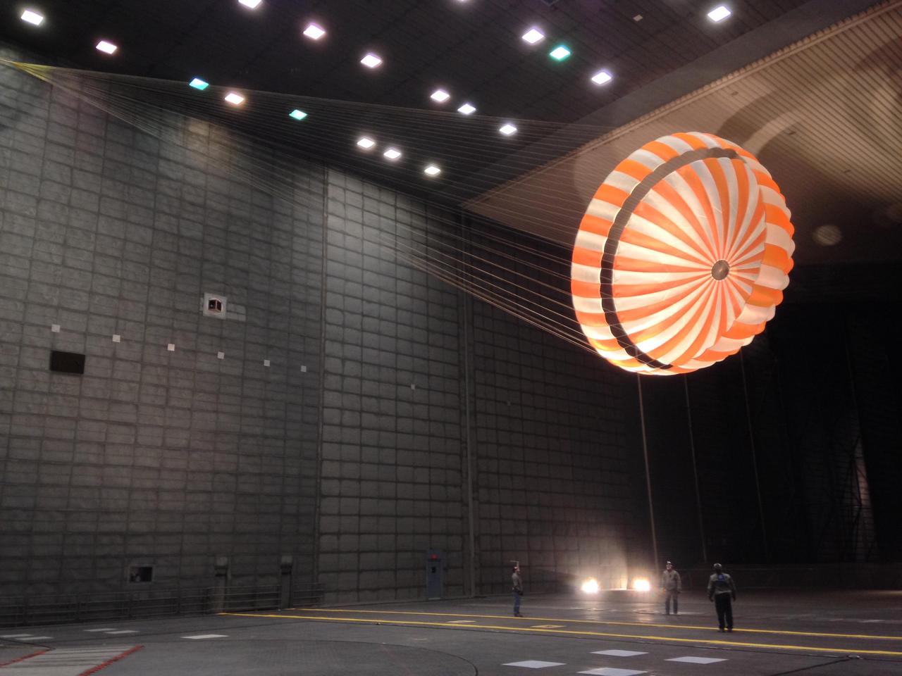 This parachute testing for NASA's InSight mission to Mars was conducted inside the world's largest wind tunnel, at NASA Ames Research Center, Moffett Field, California, in February 2015. The wind tunnel is 80 feet (24 meters) tall and 120 feet (37 meters) wide. It is part of the National Full-Scale Aerodynamics Complex, operated by the Arnold Engineering Development Center of the U.S. Air Force. Note: After thorough examination, NASA managers have decided to suspend the planned March 2016 launch of the Interior Exploration using Seismic Investigations Geodesy and Heat Transport (InSight) mission. The decision follows unsuccessful attempts to repair a leak in a section of the prime instrument in the science payload. http://photojournal.jpl.nasa.gov/catalog/PIA19405