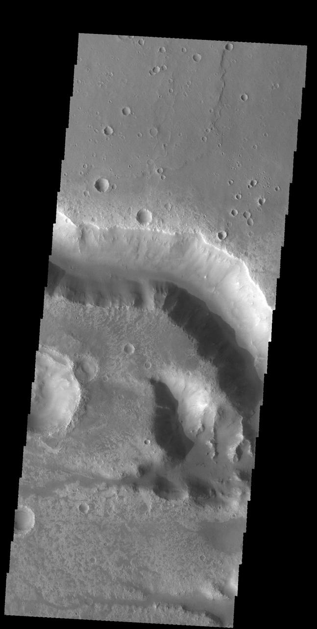This image captured by NASA 2001 Mars Odyssey spacecraft shows a portion of Her Desher Vallis, located in Noachis Terra. Orbit Number: 58626 Latitude: -25.3889 Longitude: 312.639 Instrument: VIS Captured: 2015-03-02 23:20 http://photojournal.jpl.nasa.gov/catalog/PIA19446
