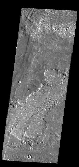 This image captured by NASA 2001 Mars Odyssey spacecraft shows a small portion of the lava flows that comprise Daedalia Planum. These flows originated at Arsia Mons. Orbit Number: 58691 Latitude: -24.3187 Longitude: 237.76 Instrument: VIS Captured: 2015-03-08 07:47 http://photojournal.jpl.nasa.gov/catalog/PIA19451