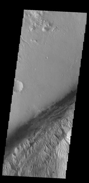 This image captured by NASA 2001 Mars Odyssey spacecraft shows part of Gale Crater, the home of the Curiosity Rover. Orbit Number: 59044 Latitude: -4.48044 Longitude: 137.355 Instrument: VIS Captured: 2015-04-06 09:17 http://photojournal.jpl.nasa.gov/catalog/PIA19474