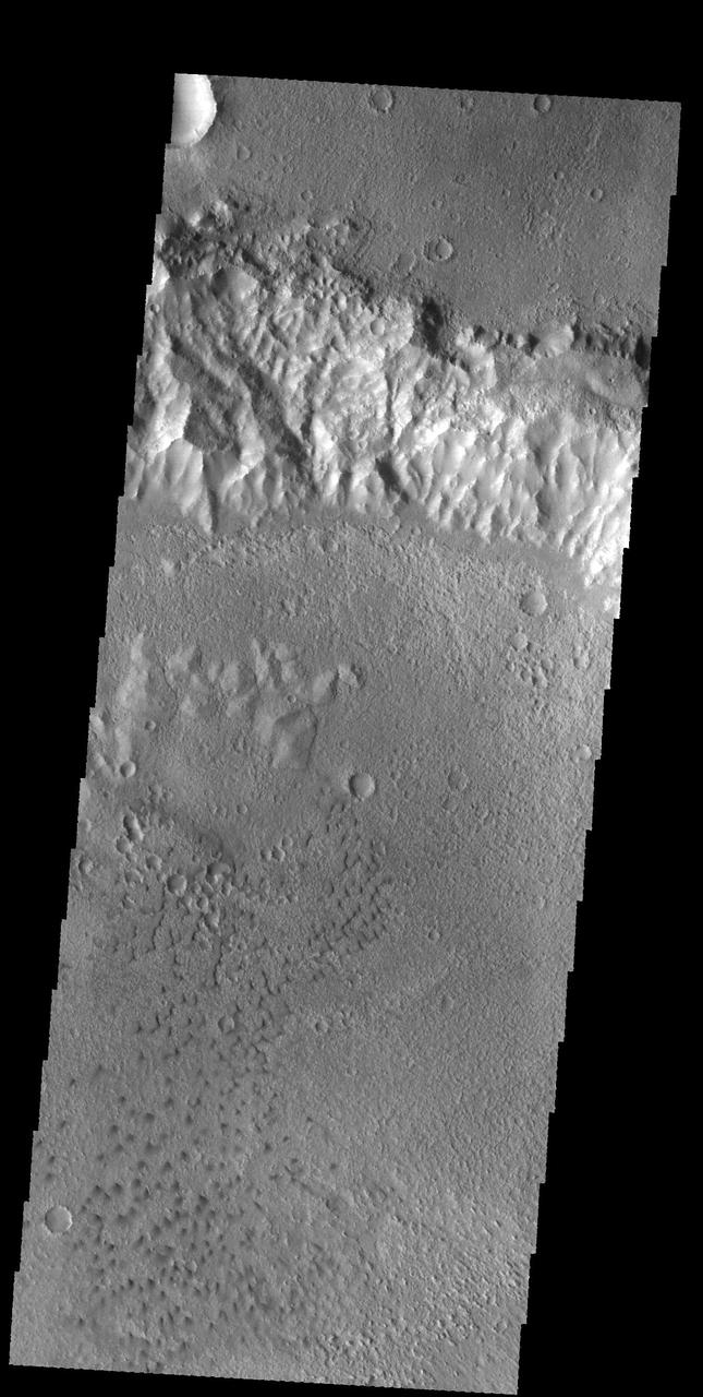 This image captured by NASA 2001 Mars Odyssey spacecraft shows a region of small isolated dunes on the floor of an unnamed crater in Terra Cimmeria. Orbit Number: 59106 Latitude: -30.4214 Longitude: 145.4 Instrument: VIS Captured: 2015-04-11 11:57 http://photojournal.jpl.nasa.gov/catalog/PIA19477