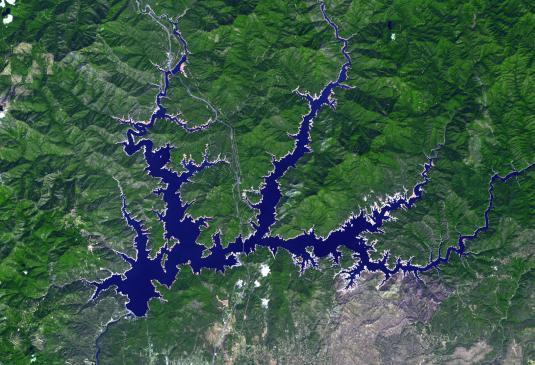 This image from NASA Terra spacecraft shows Shasta Lake in northern California, which has an area of 12,000 ha, making it the state largest reservoir.  Impacts of the continuing drought in the western US is evident in the two ASTER images acquired 9 years apart. The images were acquired September 9, 2005 and September 2, 2014. They cover an area of 27.6 x 40.4 km, and are located at 40.6 degrees north, 122.4 degrees west.  http://photojournal.jpl.nasa.gov/catalog/PIA19492