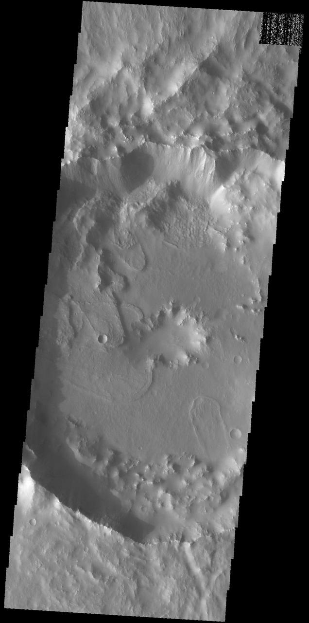 Today's VIS image shows part of Tugaske Crater. The northern margin of this crater has been modified from a circular form, most likely related to the tectonic activity of Claritas Fossae, where this crater is located. Additionally there are several landslide deposits in the crater, perhaps also formed by tectonic instability in the local region. Orbit Number: 59439 Latitude: -31.581 Longitude: 258.918 Instrument: VIS Captured: 2015-05-08 22:03 http://photojournal.jpl.nasa.gov/catalog/PIA19505
