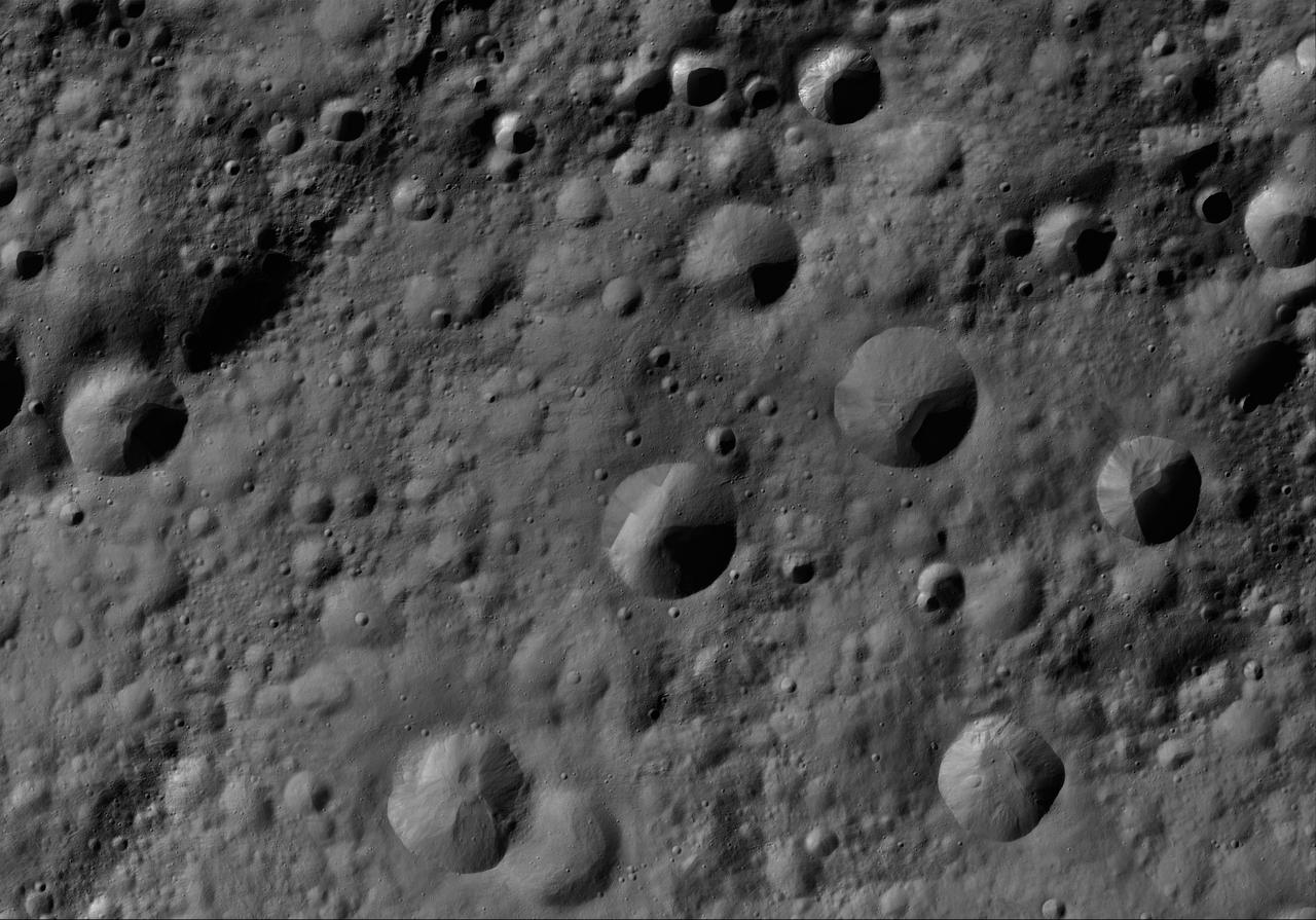 This image of Gegania AV-L-09, from the atlas of the giant asteroid Vesta, was created from images taken as NASA Dawn mission flew around the object, also known as a protoplanet. The set of maps was created from mosaics of10,000 images from Dawn's framing camera instrument, taken at a low altitude of about 130 miles (210 kilometers). This map is mostly at a scale about that of regional road touring maps, where every inch of map is equivalent to a little more than 3 miles of asteroid (one centimeter equals 2 kilometers). http://photojournal.jpl.nasa.gov/catalog/PIA19513
