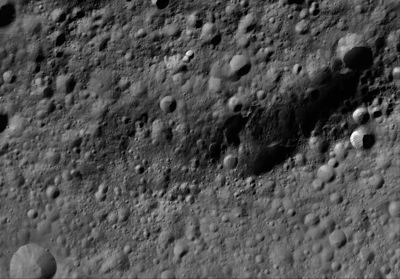 This image of Fabia AV-L-13, from the atlas of the giant asteroid Vesta, was created from images taken as NASA Dawn mission flew around the object, also known as a protoplanet. The set of maps was created from mosaics of10,000 images from Dawn's framing camera instrument, taken at a low altitude of about 130 miles (210 kilometers). This map is mostly at a scale about that of regional road touring maps, where every inch of map is equivalent to a little more than 3 miles of asteroid (one centimeter equals 2 kilometers). http://photojournal.jpl.nasa.gov/catalog/PIA19517