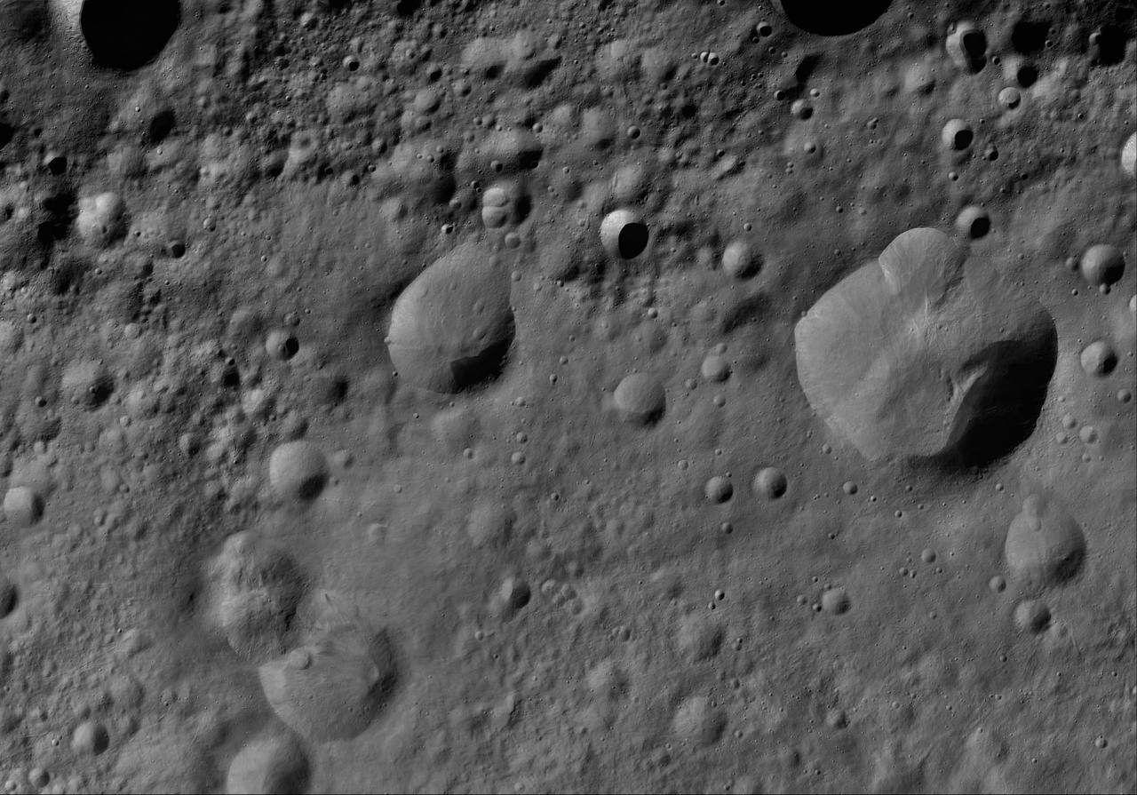 This image of Lepida AV-L-14, from the atlas of the giant asteroid Vesta, was created from images taken as NASA Dawn mission flew around the object, also known as a protoplanet. The set of maps was created from mosaics of10,000 images from Dawn's framing camera instrument, taken at a low altitude of about 130 miles (210 kilometers). This map is mostly at a scale about that of regional road touring maps, where every inch of map is equivalent to a little more than 3 miles of asteroid (one centimeter equals 2 kilometers). http://photojournal.jpl.nasa.gov/catalog/PIA19518