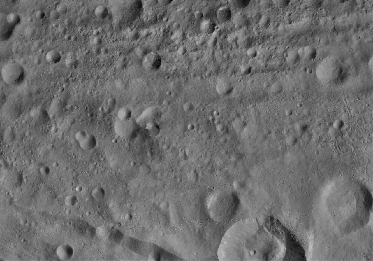 This image of Rubria AV-L-16, from the atlas of the giant asteroid Vesta, was created from images taken as NASA Dawn mission flew around the object, also known as a protoplanet. The set of maps was created from mosaics of10,000 images from Dawn's framing camera instrument, taken at a low altitude of about 130 miles (210 kilometers). This map is mostly at a scale about that of regional road touring maps, where every inch of map is equivalent to a little more than 3 miles of asteroid (one centimeter equals 2 kilometers). http://photojournal.jpl.nasa.gov/catalog/PIA19520