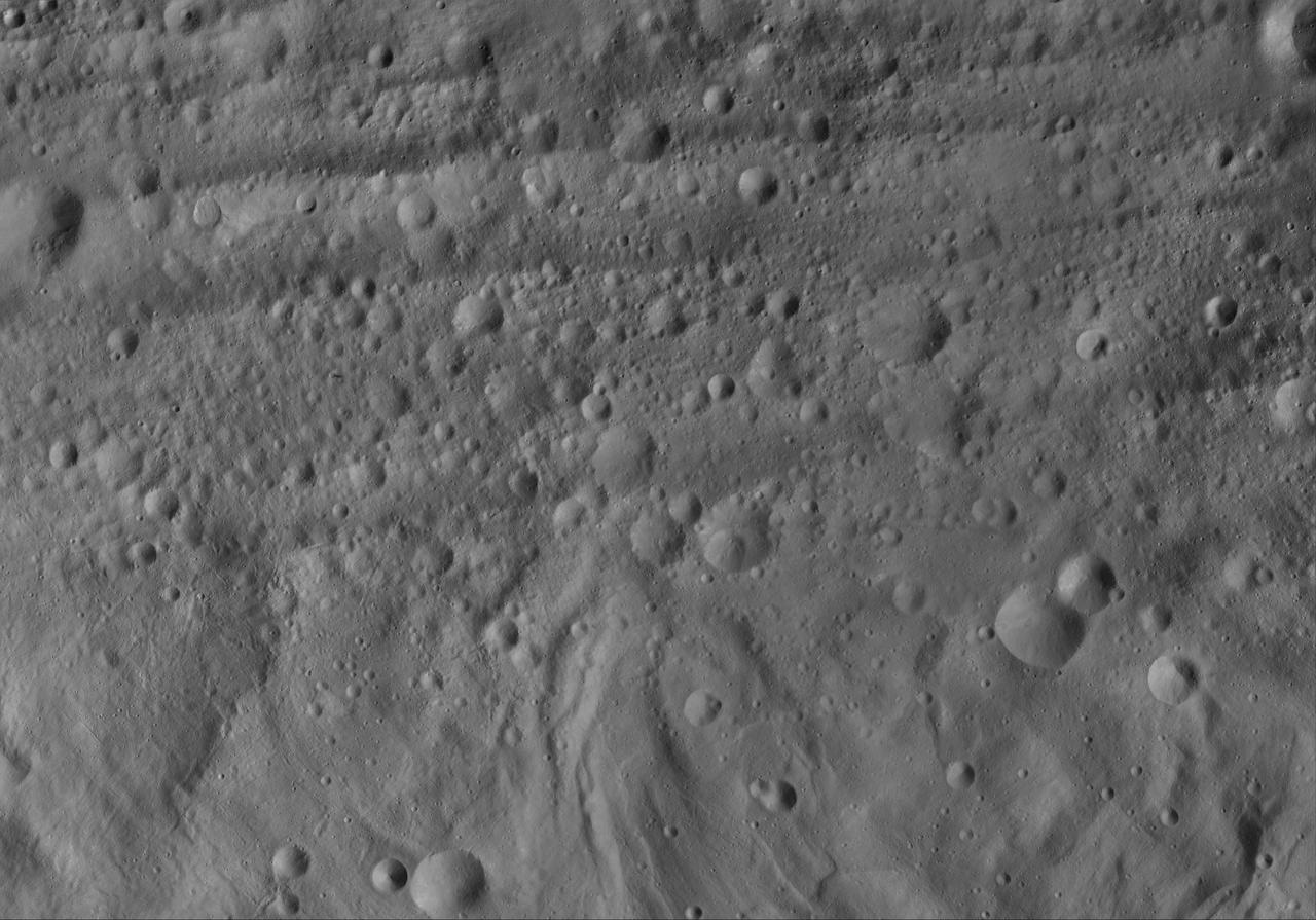 This image of Domna AV-L-17, from the atlas of the giant asteroid Vesta, was created from images taken as NASA Dawn mission flew around the object, also known as a protoplanet. The set of maps was created from mosaics of10,000 images from Dawn's framing camera instrument, taken at a low altitude of about 130 miles (210 kilometers). This map is mostly at a scale about that of regional road touring maps, where every inch of map is equivalent to a little more than 3 miles of asteroid (one centimeter equals 2 kilometers). http://photojournal.jpl.nasa.gov/catalog/PIA19521