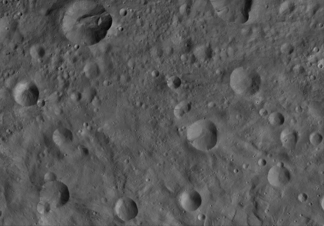 This image of Octavia AV-L-19, from the atlas of the giant asteroid Vesta, was created from images taken as NASA Dawn mission flew around the object, also known as a protoplanet. The set of maps was created from mosaics of10,000 images from Dawn's framing camera instrument, taken at a low altitude of about 130 miles (210 kilometers). This map is mostly at a scale about that of regional road touring maps, where every inch of map is equivalent to a little more than 3 miles of asteroid (one centimeter equals 2 kilometers). http://photojournal.jpl.nasa.gov/catalog/PIA19523