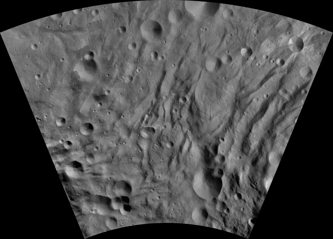 This image of Canuleia AV-L-28, from the atlas of the giant asteroid Vesta, was created from images taken as NASA Dawn mission flew around the object, also known as a protoplanet. The set of maps was created from mosaics of10,000 images from Dawn's framing camera instrument, taken at a low altitude of about 130 miles (210 kilometers). This map is mostly at a scale about that of regional road touring maps, where every inch of map is equivalent to a little more than 3 miles of asteroid (one centimeter equals 2 kilometers). http://photojournal.jpl.nasa.gov/catalog/PIA19532