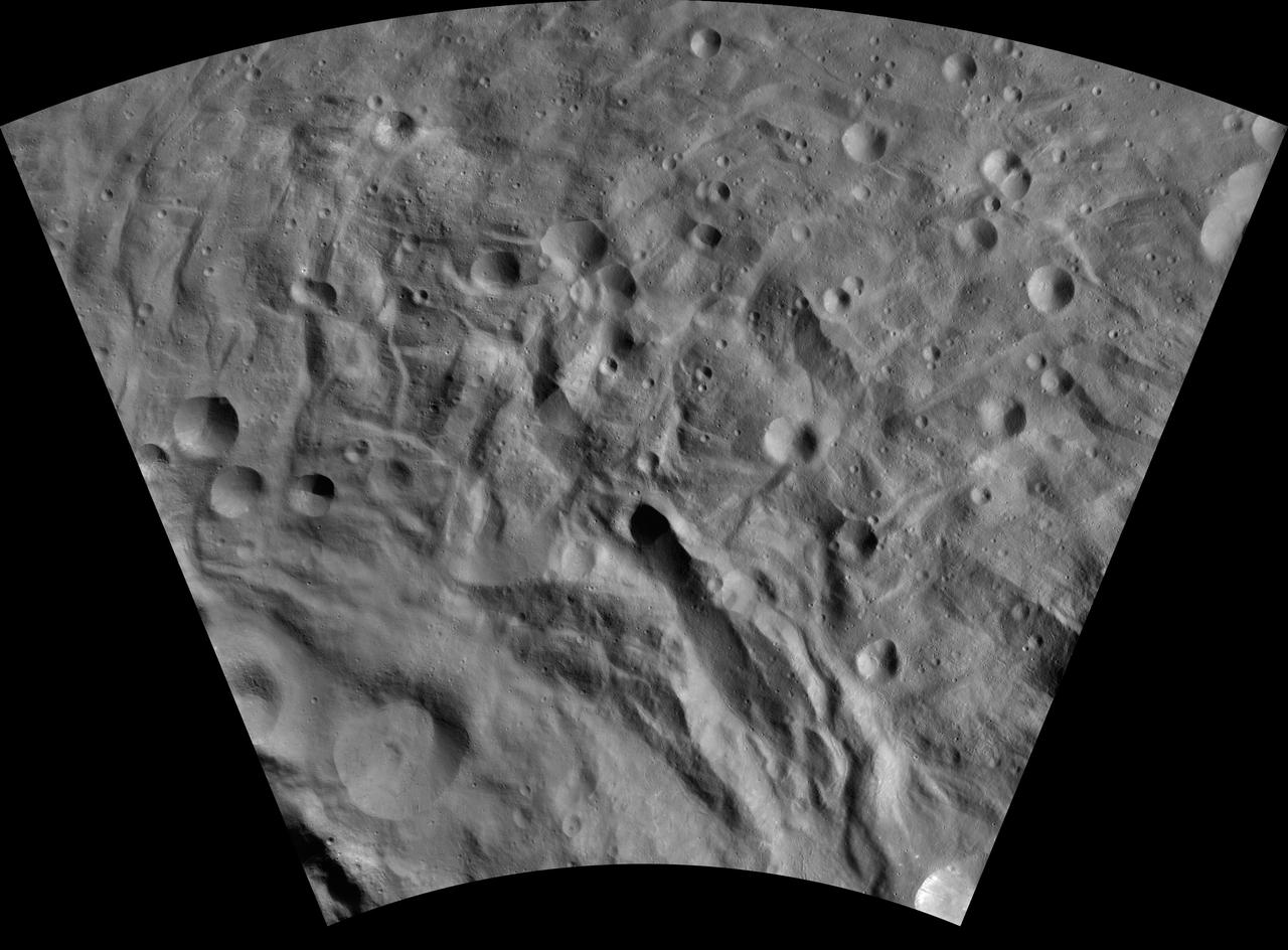 This image of Justina AV-L-29, from the atlas of the giant asteroid Vesta, was created from images taken as NASA Dawn mission flew around the object, also known as a protoplanet. The set of maps was created from mosaics of10,000 images from Dawn's framing camera instrument, taken at a low altitude of about 130 miles (210 kilometers). This map is mostly at a scale about that of regional road touring maps, where every inch of map is equivalent to a little more than 3 miles of asteroid (one centimeter equals 2 kilometers). http://photojournal.jpl.nasa.gov/catalog/PIA19533