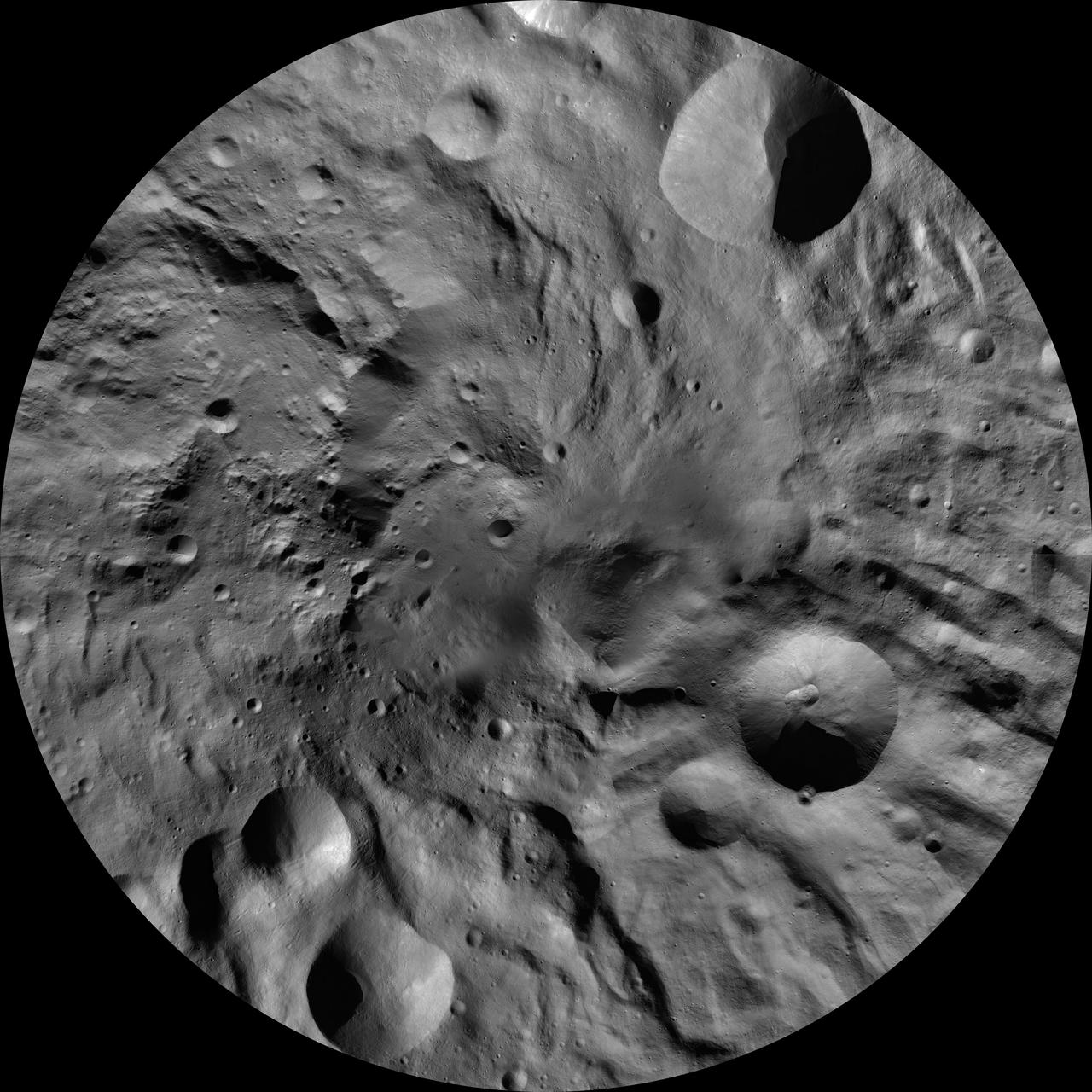 This image of Rheasilvia AV-L-30, from the atlas of the giant asteroid Vesta, was created from images taken as NASA Dawn mission flew around the object, also known as a protoplanet. The set of maps was created from mosaics of10,000 images from Dawn's framing camera instrument, taken at a low altitude of about 130 miles (210 kilometers). This map is mostly at a scale about that of regional road touring maps, where every inch of map is equivalent to a little more than 3 miles of asteroid (one centimeter equals 2 kilometers). http://photojournal.jpl.nasa.gov/catalog/PIA19534