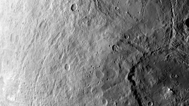 A large crater in the southern hemisphere of dwarf planet Ceres is seen in this image taken by NASA's Dawn spacecraft on June 6, 2015. This image shows many different surface structures associated with impacts. This is among the first snapshots from Dawn's second mapping orbit, which is 2,700 miles (4,400 kilometers) in altitude. The resolution is 1,400 feet (410 meters) per pixel. http://photojournal.jpl.nasa.gov/catalog/PIA19569