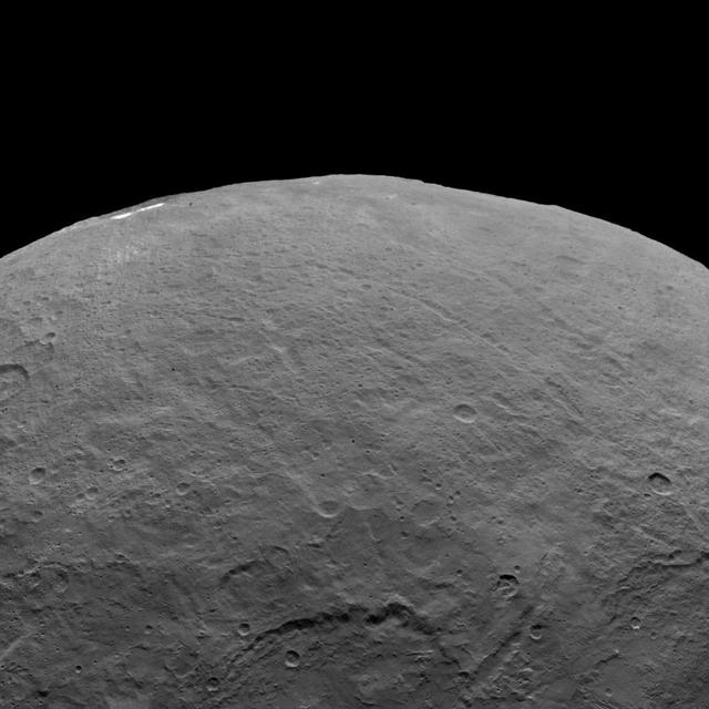 This image, taken by NASA Dawn spacecraft, shows dwarf planet Ceres from an altitude of 2,700 miles 4,400 kilometers. The image, with a resolution of 1,400 feet 410 meters per pixel, was taken on June 6, 2015.  http://photojournal.jpl.nasa.gov/catalog/PIA19576