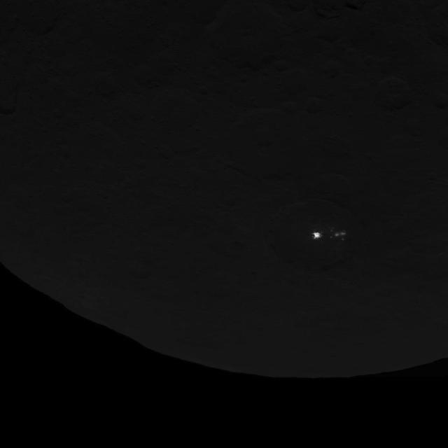 This image of dwarf planet Ceres, taken by NASA's Dawn spacecraft on June 15, 2015, shows a cluster of mysterious spots that are clearly brighter than their surroundings. Dawn took this image at an altitude of 2,700 miles (4,400 kilometers). The resolution is 1,400 feet (410 meters) per pixel.   http://photojournal.jpl.nasa.gov/catalog/PIA19584